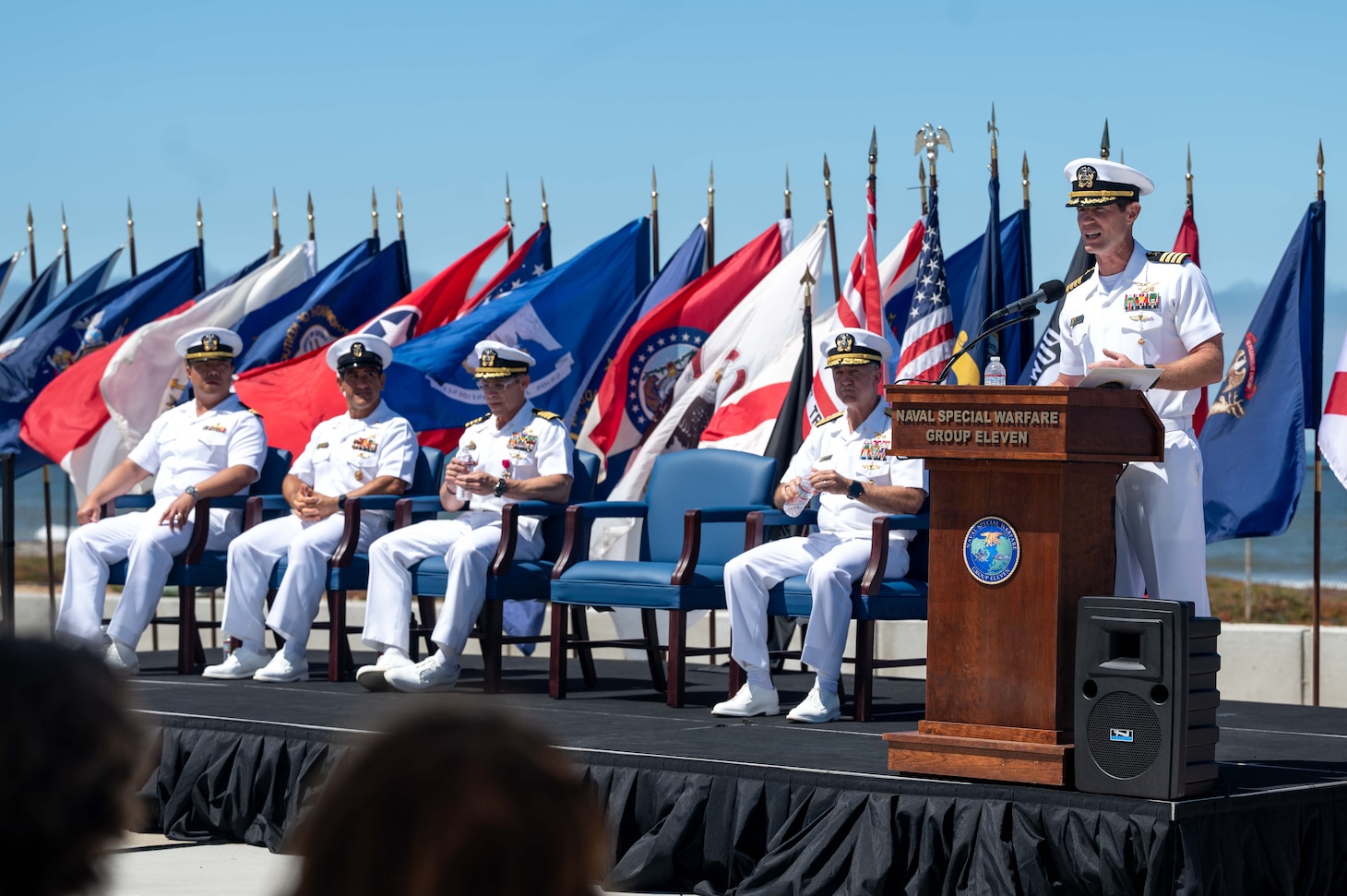 Capt. Christopher E. Wear salutes Capt. Stephen M. Healey as Healey assumes command of Naval Special Warfare Group (NSWG) 11 during a ceremony presided over by Rear Adm. Milton J. Sands III, commander, Naval Special Warfare Command. NSWG-11, a component of U.S. Naval Special Warfare Command, is composed of Navy Reserve SEAL and SWCC units.