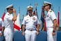 Capt. Christopher E. Wear salutes Capt. Stephen M. Healey as Healey assumes command of Naval Special Warfare Group (NSWG) 11 during a ceremony presided over by Rear Adm. Milton J. Sands III, commander, Naval Special Warfare Command. NSWG-11, a component of U.S. Naval Special Warfare Command, is composed of Navy Reserve SEAL and SWCC units.
