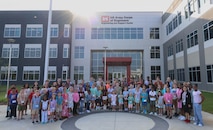 STEM Day group photo outside the U.S. Army Engineering and Support Center, Huntsville building on Redstone Arsenal.