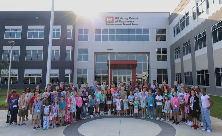 STEM Day group photo outside the U.S. Army Engineering and Support Center, Huntsville building on Redstone Arsenal.