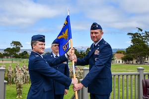 U.S. Air Force Col. Jason Guyette, 517th Training Group commander, passed the guidon to Lt. Col. Kevin Hawkins, incoming 314th training Squadron commander, at the assumption of command ceremony at Soldiers Field, Presidio of Monterey, California, July 25. As commander, Hawkins will lead the squadron in shaping linguists ready to support global intelligence and national security missions across the Department of Defense. (Courtesy photo)