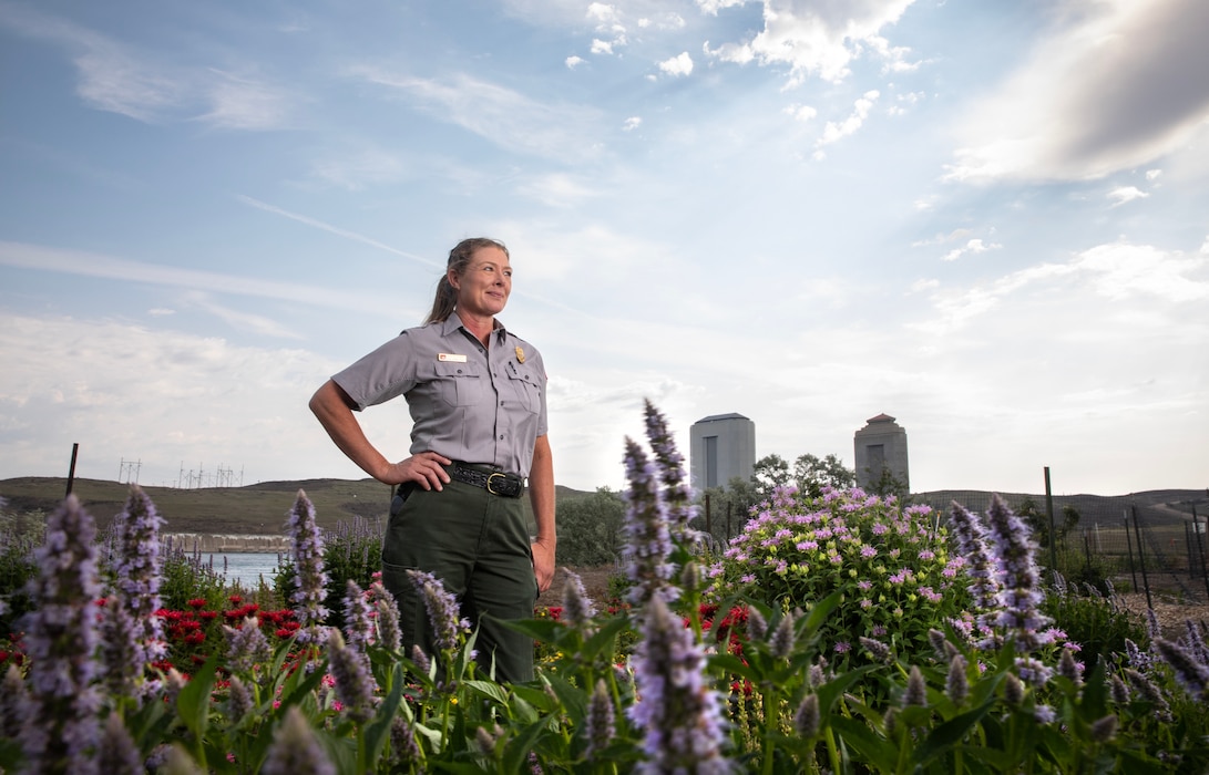 Patricia Gilbert-Ball, a natural resources specialist and park ranger with the U.S. Army Corps of Engineers, Omaha District’s Fort Peck Project in Montana, smiles for a portrait in at the project’s Bee Haven Pollinator Garden and Interpretive Trail, July 19, 2025.
