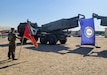 A U.S. Army Soldier assigned to 1st Battalion, 623d Field Artillery Regiment, 138th Field Artillery Brigade bears the guidon in front of formation as their M142 High Mobility Artillery Rocket Systems (HIMARS) display the Kentucky flag.