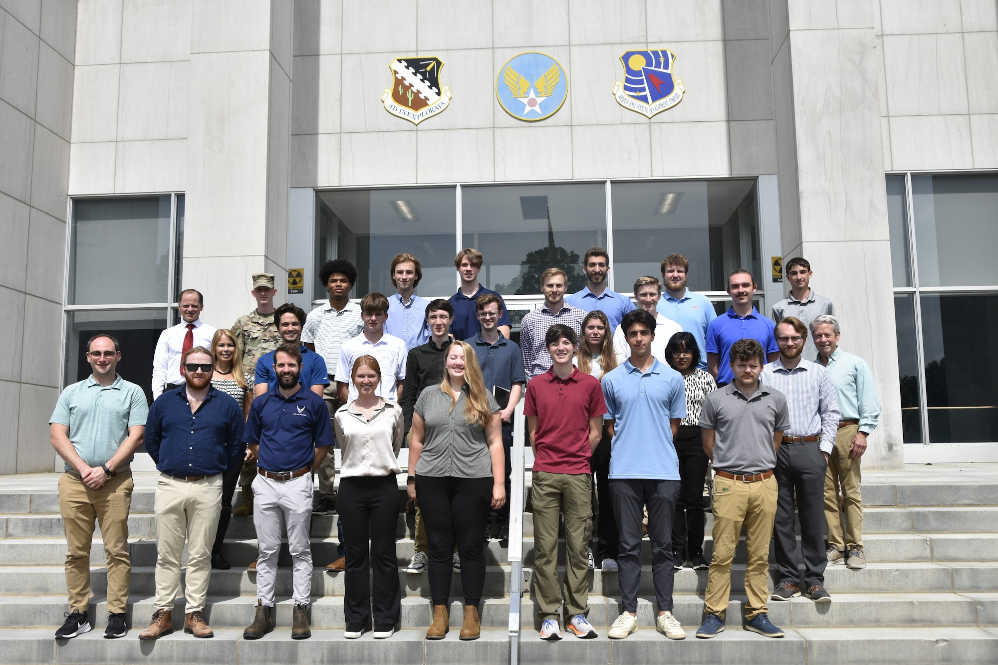 Interns with the Arnold Engineering Development Complex Test Operations and Sustainment and Technical Management and Advisory Services contractors join Test Resource Management Center-sponsored Air Force interns, base intern program managers, mentors and complex leadership for a group photo June 12, 2025, at Arnold Air Force Base, Tenn., headquarters of AEDC. This year, 21 interns across the three organizations worked at Arnold AFB, giving them experience in a professional setting. (U.S. Air Force photo by Brad Hicks)