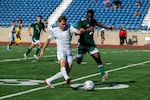 U.S. Air Force Airmen and Army Soldier fights for control of the ball during the Armed Forces Men’s Soccer Championship in Phantom Warrior Stadium, Fort Hood, Texas, on July 30, 2025. Each team faces off in a bracket to determine which service will hold the championship title, featuring teams from the Army, Navy, and Air Force. (U.S. Army photo by Sgt. Tien Dat Ngo)