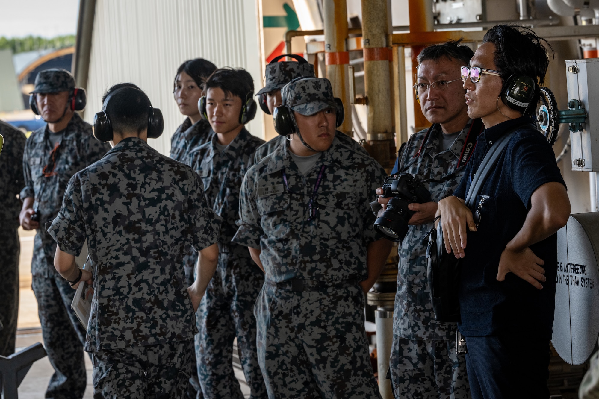 Japan Air Self-Defense Force airmen assigned to the 3rd Air Wing observe a hot pit refueling of an 14th Fighter Squadron F-16C Fighting Falcon  as part of exercise Resolute Force Pacific 2025