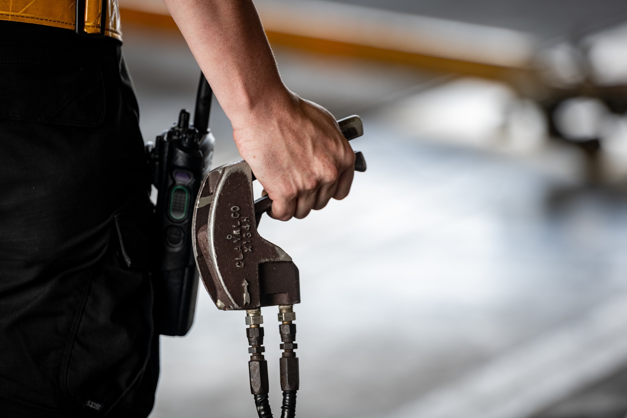 U.S. Air Force Staff Sgt. Logan Evans, 14th Fighter Generation Squadron crew chief, holds a dead man’s switch during a hot pit refueling of an F-16C Fighting Falcon as part of exercise Resolute Force Pacific  2025