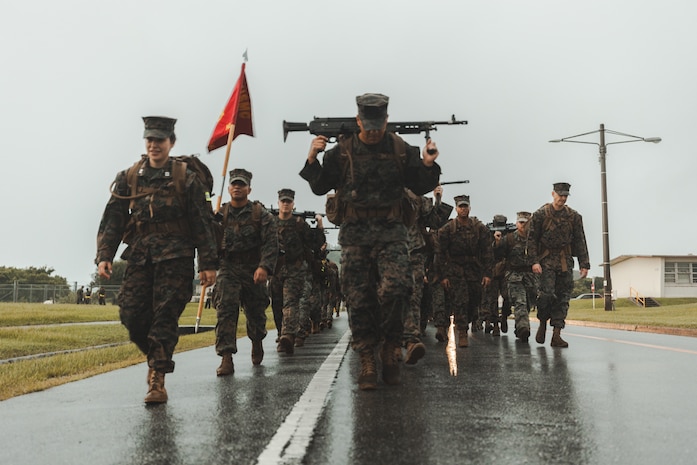 U.S. Marines with III Marine Expeditionary Force conduct a 10-kilometer hike on Camp Courtney, Japan, July 28, 2025.