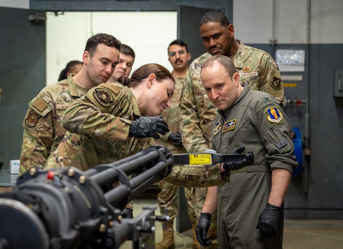 U.S. Air Force Senior Airman Cassandra Porter, 35th Maintenance Squadron armament support journeyman, explains the inspecting procedure of an M61A1 gun to Col. Matthew Kenkel, 35th Fighter Wing (FW) deputy commander, during a Wild Weasel Walk-through.