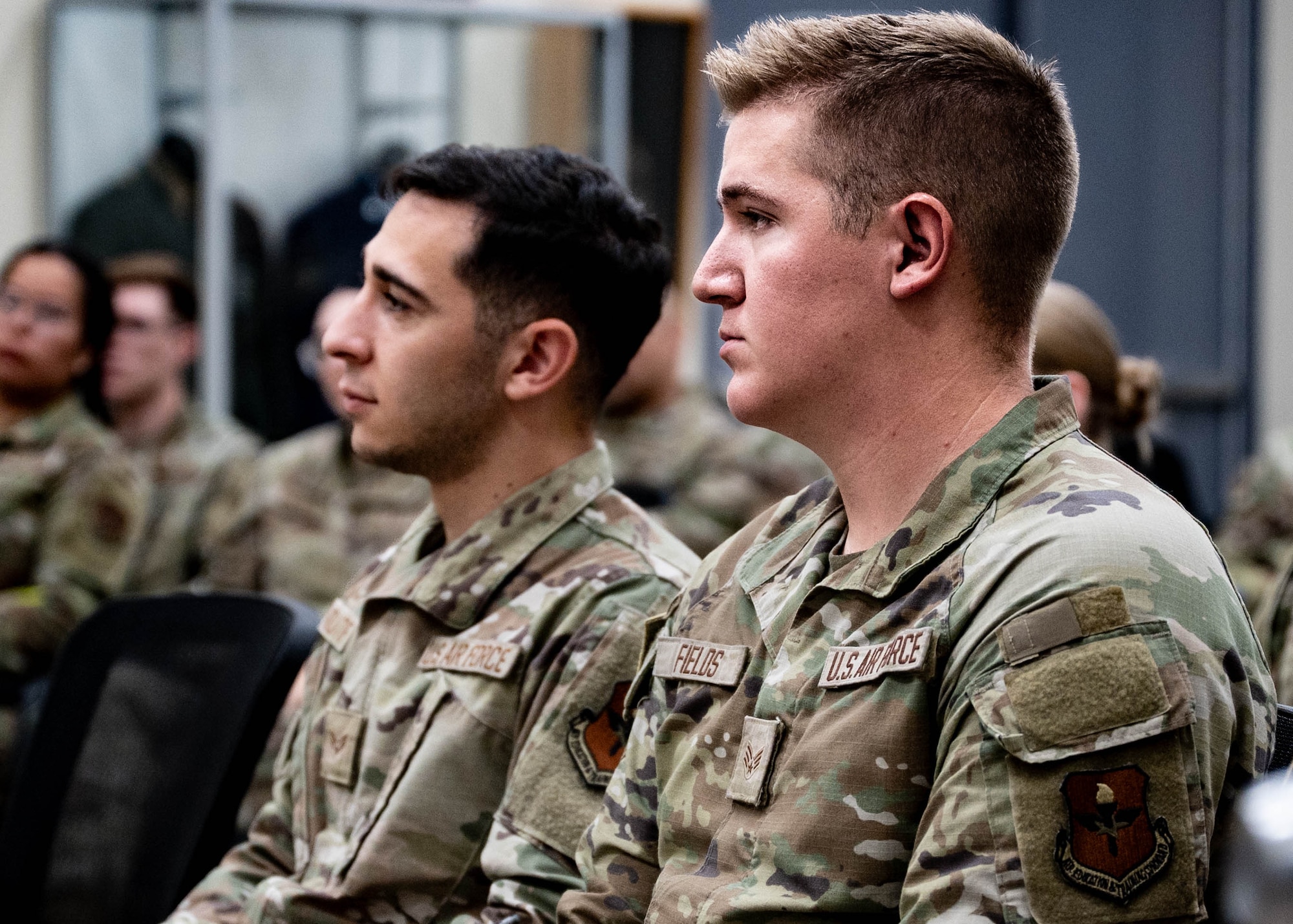 U.S. Air Force Senior Airman Ryan Fields (right), 56th Fighter Wing airman leadership school student, listens to a mentorship talk with other students