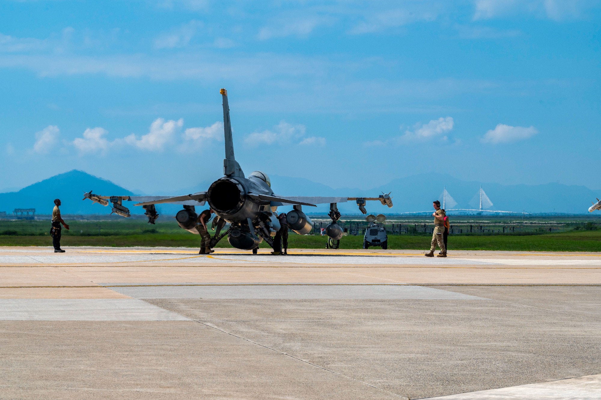Airmen from the 8th Maintenance Group perform last minute pre-flight weapon checks on F-16 Fighting Falcon aircraft