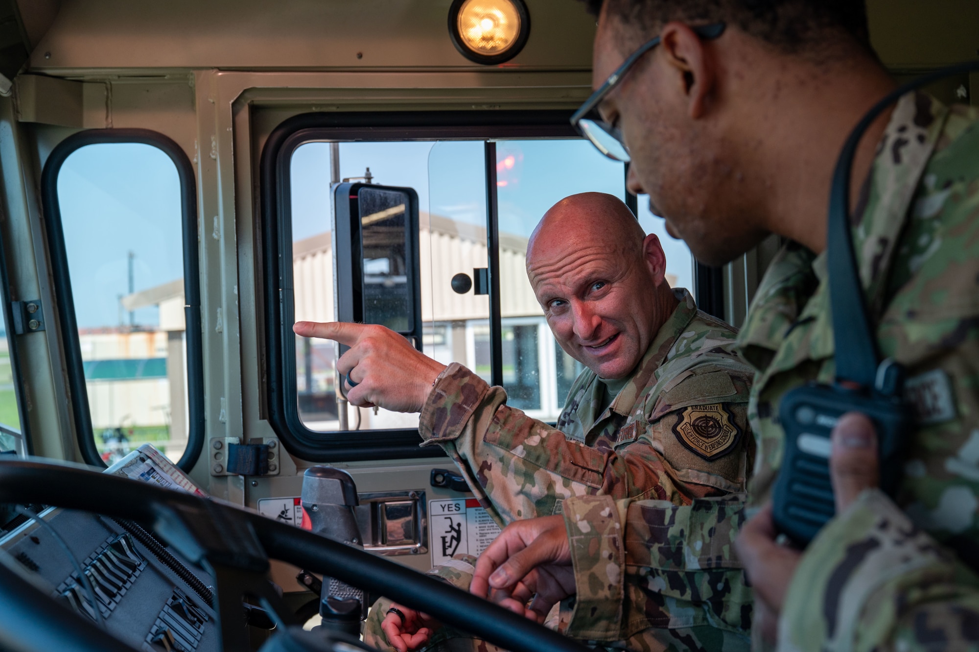 Chief Master Sgt. Thomas Schaefer II, Seventh Air Force command chief, asks about flightline fire station capabilities at Kunsan Air Base, Republic of Korea, July 29, 2025. During his visit, Schaefer focused on connecting with Wolf Pack units and engaging directly with Airmen.