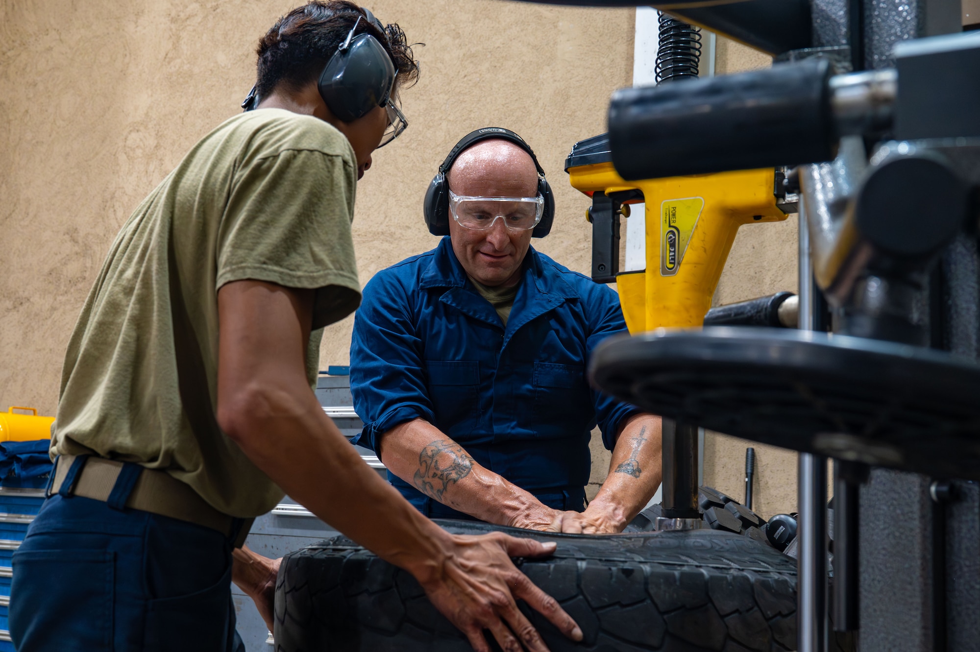 Chief Master Sgt. Thomas Schaefer II, Seventh Air Force command chief, changes a tire with Senior Airman Ranel Generosa, 8th Logistic Readiness Squadron vehicle maintenance journeyman, at Kunsan Air Base, Republic of Korea, July 30, 2025. Schaefer’s intent was to learn about the base, the various unit missions and the Airmen who support them.