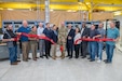 Photo of a group of people cutting the ribbon