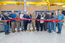 Photo of a group of people cutting the ribbon