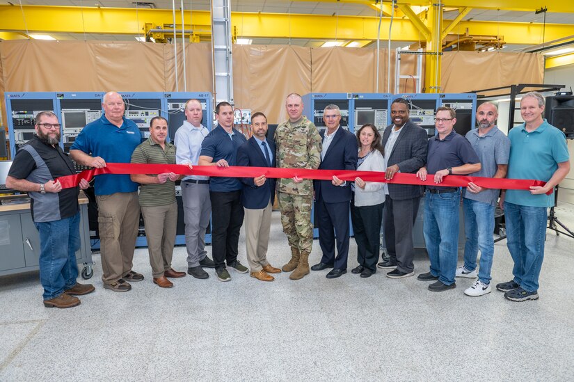Photo of a group of people cutting the ribbon