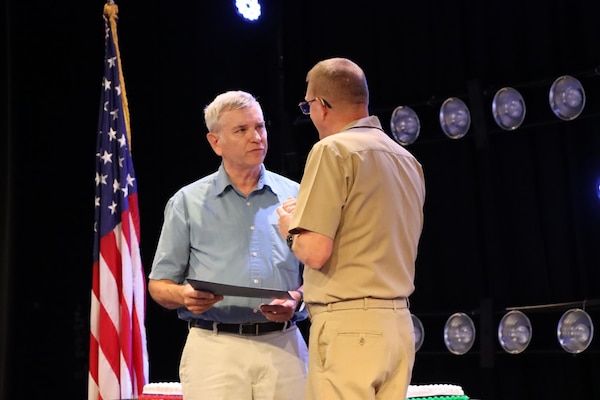 Vice Adm. Johnny R. Wolfe, Jr. awarded Mr. Leroy Smith his  50 year Fleet Ballistic Program pin during the celebratory event at NewLife Training Center on 16 July, in honor of the 70th anniversary of Strategic Systems Programs. As a part of the SSP team, Strategic Weapons Facility Pacific provides dedication to assembling, maintaining, and storing Trident II D5 Missiles and deploying them on fleet ballistic missile submarines. We are devoted to serving our nation by providing safe, secure, credible, and affordable sea-based missile systems. The ceremony is one of several events leading up to SSP’s anniversary on November 17, 2025, intended to highlight the vast network of people and expertise required to ensure SSP’s no-fail mission. Since SSP was stood up in 1955, it has retained the cradle-to-grave responsibility for the submarine-launched ballistic missile (SLBM) strategic weapon system. Today, that system is the Trident II D5LE deployed on Ohio-class SSBNs for strategic patrol, supporting the U.S. Navy’s role in maintaining peace through strength. SSP is also modernizing the Navy’s SWS for the future Columbia-class SSBNs and is pioneering advanced regional strike capabilities with SLCM-N and the non-nuclear CPS programs to enhance our nation’s maritime dominance. This year’s celebration coincides with the 250th birthday of the U.S. Navy on Oct. 13. For 250 years, America’s Navy has promoted prosperity and security, deterred aggression, and protected the American way of life.”

(U.S. Navy photo by Cody Brown/Released)