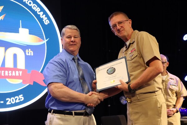 Vice Adm. Johnny R. Wolfe, Jr. awarded Mr. Dale Borer his  40 year Fleet Ballistic Program pin and his 50 years of service pin during the celebratory event at NewLife Training Center on 16 July, in honor of the 70th anniversary of Strategic Systems Programs. As a part of the SSP team, Strategic Weapons Facility Pacific provides dedication to assembling, maintaining, and storing Trident II D5 Missiles and deploying them on fleet ballistic missile submarines. We are devoted to serving our nation by providing safe, secure, credible, and affordable sea-based missile systems. The ceremony is one of several events leading up to SSP’s anniversary on November 17, 2025, intended to highlight the vast network of people and expertise required to ensure SSP’s no-fail mission. Since SSP was stood up in 1955, it has retained the cradle-to-grave responsibility for the submarine-launched ballistic missile (SLBM) strategic weapon system. Today, that system is the Trident II D5LE deployed on Ohio-class SSBNs for strategic patrol, supporting the U.S. Navy’s role in maintaining peace through strength. SSP is also modernizing the Navy’s SWS for the future Columbia-class SSBNs and is pioneering advanced regional strike capabilities with SLCM-N and the non-nuclear CPS programs to enhance our nation’s maritime dominance. This year’s celebration coincides with the 250th birthday of the U.S. Navy on Oct. 13. For 250 years, America’s Navy has promoted prosperity and security, deterred aggression, and protected the American way of life.”

(U.S. Navy photo by Cody Brown/Released)