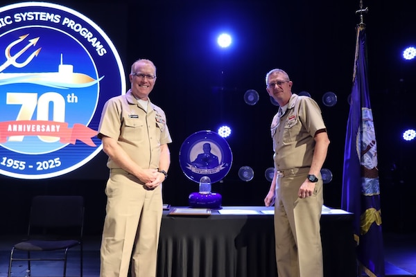 Vice Adm. Johnny R. Wolfe, Jr presented the 2024 Raborn Award to Capt. Michael Woehrman, commanding officer of Strategic Weapons Facility Pacific (SWFPAC) at the celebratory event at NewLife Training Center on 16 July, in honor of the 70th anniversary of Strategic Systems Programs. As a part of the SSP team, Strategic Weapons Facility Pacific provides dedication to assembling, maintaining, and storing Trident II D5 Missiles and deploying them on fleet ballistic missile submarines. We are devoted to serving our nation by providing safe, secure, credible, and affordable sea-based missile systems. The ceremony is one of several events leading up to SSP’s anniversary on November 17, 2025, intended to highlight the vast network of people and expertise required to ensure SSP’s no-fail mission. Since SSP was stood up in 1955, it has retained the cradle-to-grave responsibility for the submarine-launched ballistic missile (SLBM) strategic weapon system. Today, that system is the Trident II D5LE deployed on Ohio-class SSBNs for strategic patrol, supporting the U.S. Navy’s role in maintaining peace through strength. SSP is also modernizing the Navy’s SWS for the future Columbia-class SSBNs and is pioneering advanced regional strike capabilities with SLCM-N and the non-nuclear CPS programs to enhance our nation’s maritime dominance. This year’s celebration coincides with the 250th birthday of the U.S. Navy on Oct. 13. For 250 years, America’s Navy has promoted prosperity and security, deterred aggression, and protected the American way of life.

(U.S. Navy photo by Cody Brown/Released)