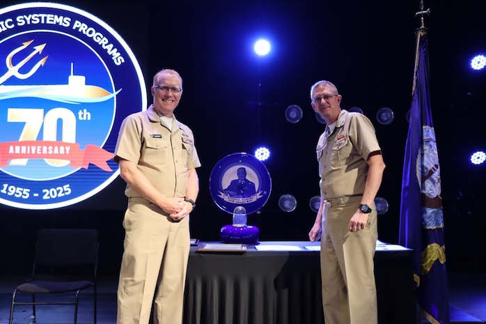 Vice Adm. Johnny R. Wolfe, Jr presented the 2024 Raborn Award to Capt. Michael Woehrman, commanding officer of Strategic Weapons Facility Pacific (SWFPAC) at the celebratory event at NewLife Training Center on 16 July, in honor of the 70th anniversary of Strategic Systems Programs. As a part of the SSP team, Strategic Weapons Facility Pacific provides dedication to assembling, maintaining, and storing Trident II D5 Missiles and deploying them on fleet ballistic missile submarines. We are devoted to serving our nation by providing safe, secure, credible, and affordable sea-based missile systems. The ceremony is one of several events leading up to SSP’s anniversary on November 17, 2025, intended to highlight the vast network of people and expertise required to ensure SSP’s no-fail mission. Since SSP was stood up in 1955, it has retained the cradle-to-grave responsibility for the submarine-launched ballistic missile (SLBM) strategic weapon system. Today, that system is the Trident II D5LE deployed on Ohio-class SSBNs for strategic patrol, supporting the U.S. Navy’s role in maintaining peace through strength. SSP is also modernizing the Navy’s SWS for the future Columbia-class SSBNs and is pioneering advanced regional strike capabilities with SLCM-N and the non-nuclear CPS programs to enhance our nation’s maritime dominance. This year’s celebration coincides with the 250th birthday of the U.S. Navy on Oct. 13. For 250 years, America’s Navy has promoted prosperity and security, deterred aggression, and protected the American way of life.

(U.S. Navy photo by Cody Brown/Released)