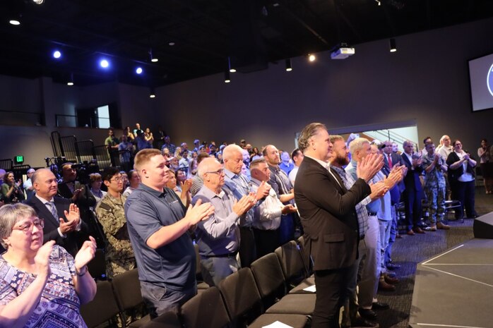 Vice Adm. Johnny R. Wolfe, Jr participated in a celebratory event at NewLife Training Center on 16 July, in honor of the 70th anniversary of Strategic Systems Programs. As a part of the SSP team, Strategic Weapons Facility Pacific provides dedication to assembling, maintaining, and storing Trident II D5 Missiles and deploying them on fleet ballistic missile submarines. We are devoted to serving our nation by providing safe, secure, credible, and affordable sea-based missile systems. The ceremony is one of several events leading up to SSP’s anniversary on November 17, 2025, intended to highlight the vast network of people and expertise required to ensure SSP’s no-fail mission. Since SSP was stood up in 1955, it has retained the cradle-to-grave responsibility for the submarine-launched ballistic missile (SLBM) strategic weapon system. Today, that system is the Trident II D5LE deployed on Ohio-class SSBNs for strategic patrol, supporting the U.S. Navy’s role in maintaining peace through strength. SSP is also modernizing the Navy’s SWS for the future Columbia-class SSBNs and is pioneering advanced regional strike capabilities with SLCM-N and the non-nuclear CPS programs to enhance our nation’s maritime dominance. This year’s celebration coincides with the 250th birthday of the U.S. Navy on Oct. 13. For 250 years, America’s Navy has promoted prosperity and security, deterred aggression, and protected the American way of life.

(U.S. Navy photo by Cody Brown/Released)