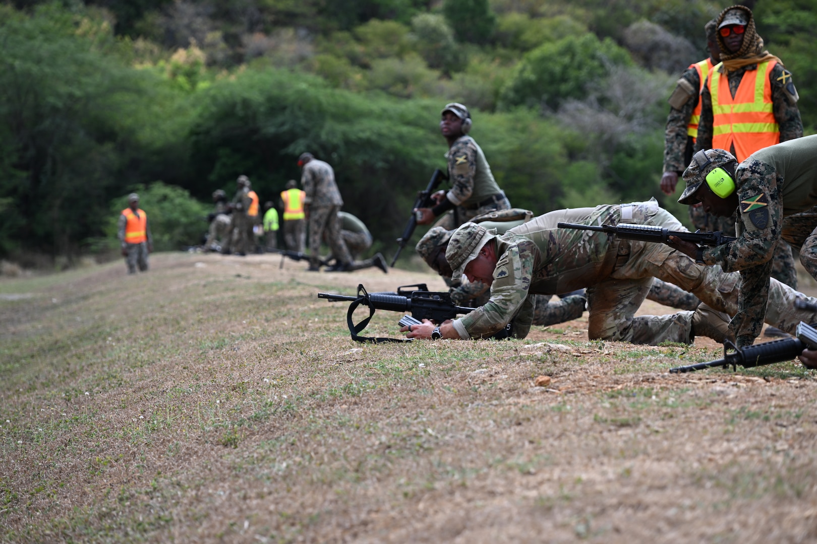 Soldiers from the D.C. National Guard, Barbados Defence Force Reserves, Jamaica Defence Force, and Jamaica National Reserve hone marksmanship skills at Twickenham Park Range in St. Catherine, Jamaica on July 17, 2025. As part of the Caribbean Regional Training Camp, activities included zeroing, firing from different positions, march-and-shoot practice, and a march-and-shoot competition. The District of Columbia National Guard's (DCNG) partnership with Jamaica, facilitated by the U.S. National Guard Bureau's State Partnership Program (SPP), promotes security cooperation through military engagements and interagency collaboration.
