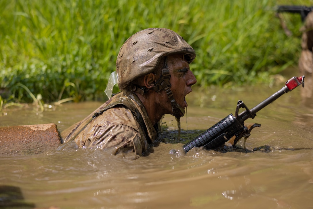 A U.S. Marine Corps officer candidate traverses “The Quigley” during the Forge at Officer Candidate School, on Marine Corps Base Quantico, Virginia, July 23, 2025. The Forge is a culminating event designed to test candidates’ endurance, leadership and resilience under pressure involving day and night hikes, simulated indirect fire, sleep deprivation, obstacle navigation and team-based exercises. (U.S. Marine Corps photo by Sgt. Dean Gurule)