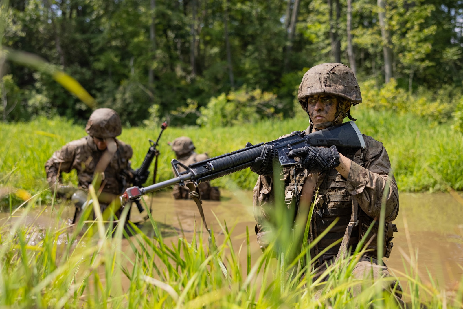 A U.S. Marine Corps officer candidate holds security while traversing “The Quigley” during the Forge at Officer Candidate School, on Marine Corps Base Quantico, Virginia, July 23, 2025. The Forge is a culminating event designed to test candidates’ endurance, leadership and resilience under pressure involving day and night hikes, simulated indirect fire, sleep deprivation, obstacle navigation and team-based exercises. (U.S. Marine Corps photo by Sgt. Dean Gurule)