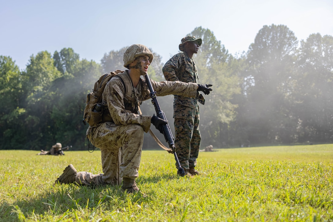 A U.S. Marine Corps officer candidate calls out orders to fellow candidates during the Forge at Officer Candidate School, on Marine Corps Base Quantico, Virginia, July 23, 2025. The Forge is a culminating event designed to test candidates’ endurance, leadership and resilience under pressure involving day and night hikes, simulated indirect fire, sleep deprivation, obstacle navigation and team-based exercises. (U.S. Marine Corps photo by Sgt. Dean Gurule)