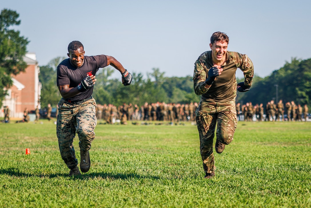 U.S. Marine Corps Sgt. Ar’kel Brown, a martial arts instructor trainer with Training Command, left, and a British Royal Marine sprint back to the starting line during a physical training circuit as part of “Virginia Tempest” at The Basic School on Marine Corps Base Quantico, Virginia, July 30, 2025. Virginia Tempest is an annual training event where Royal Marines and U.S. Marines collaborate in training such as the obstacle course, Marine Corps Martial Arts Program, and other rigorous events, ultimately designed to support interoperability and maintaining the historic working relationship between the organizations. (U.S. Marine Corps photo by Lance Cpl. Braydon Rogers)