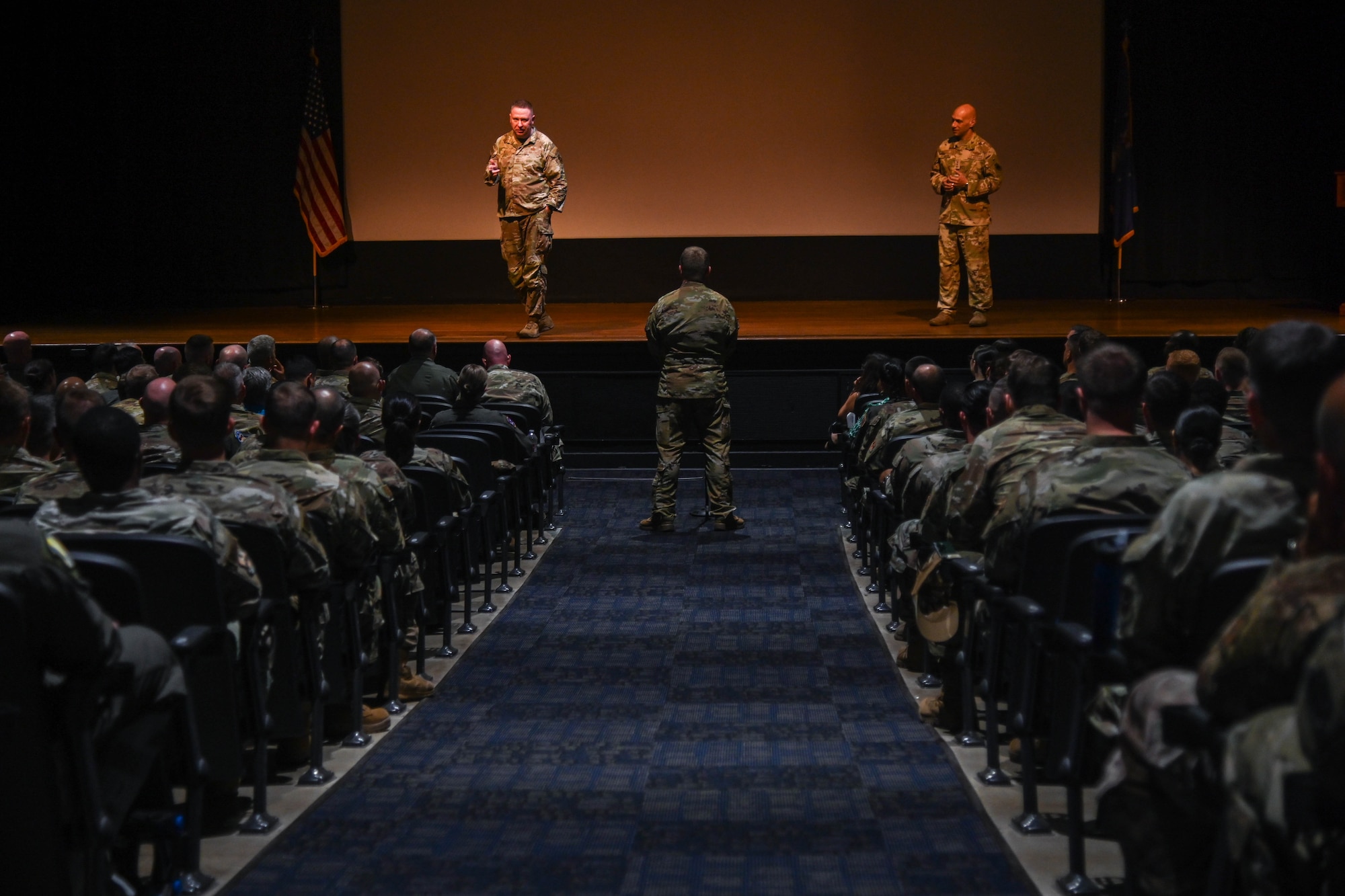 A service member asks a question at an all-call.