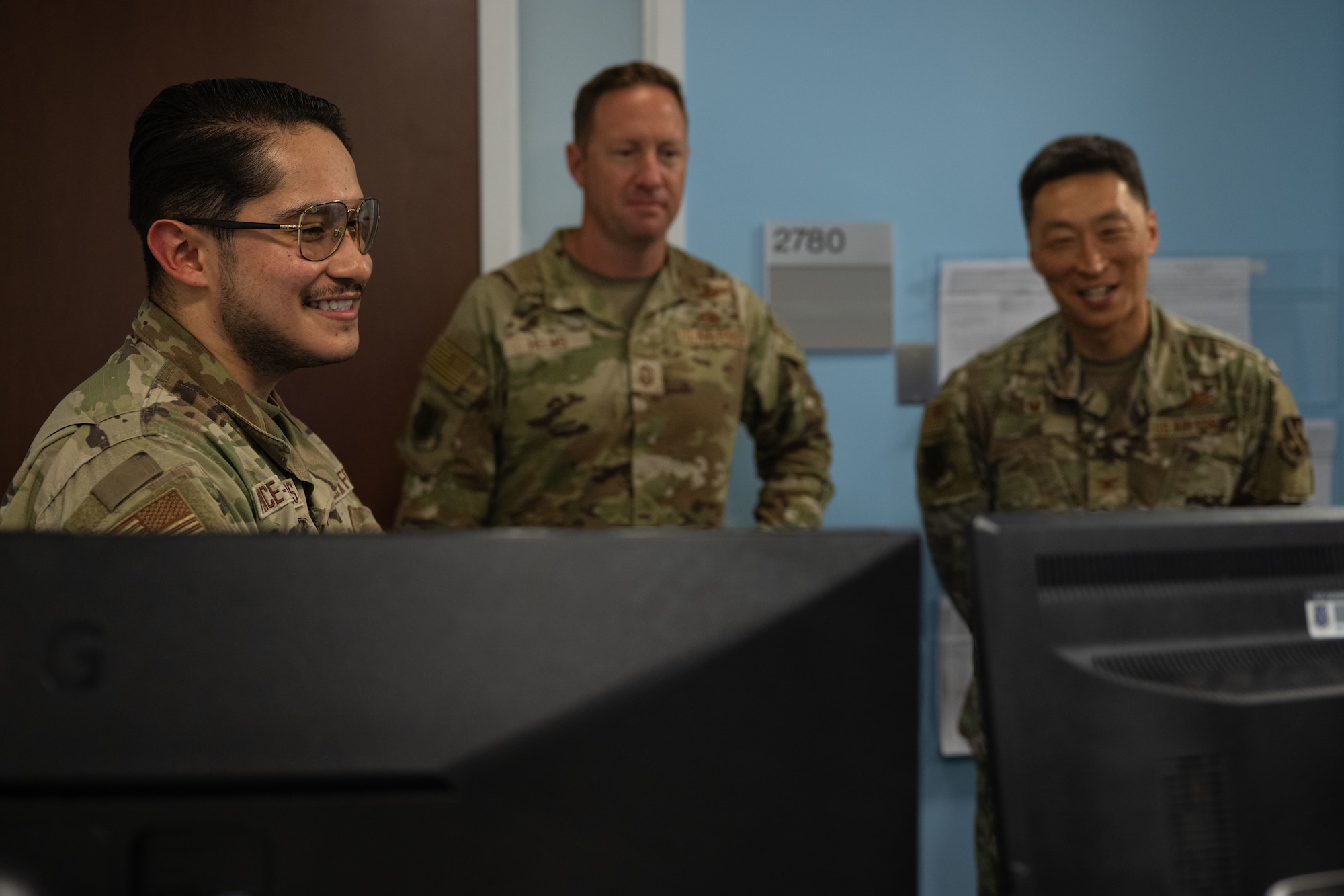 Senior Airman Bryan Ponce-Cisneros showcases CPTS operations to U.S. Air Force Col. Jun S. Oh.