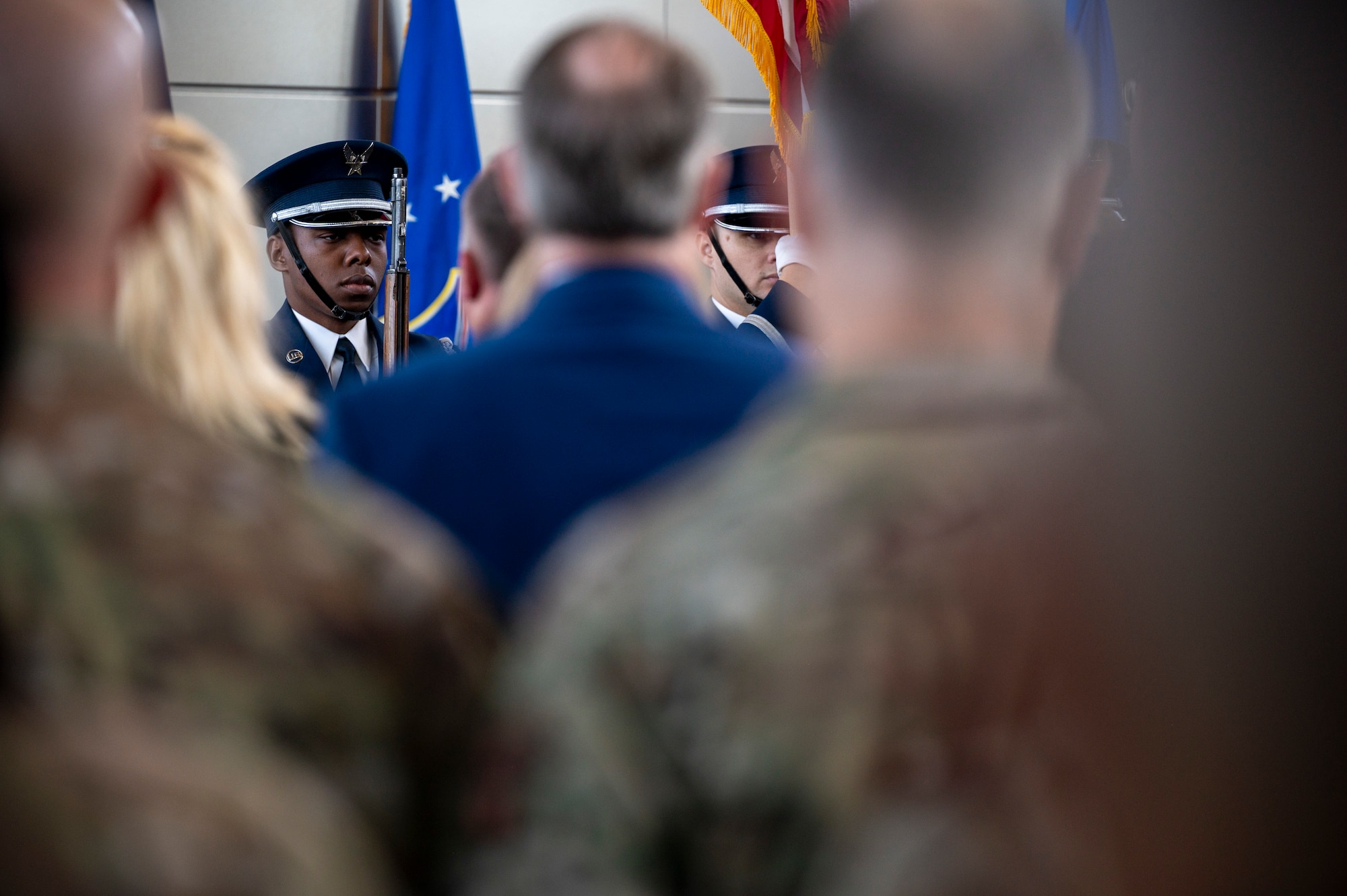 U.S. Air Force Senior Airman Khalil Reed, a ceremonial guardsman with the U.S Air Force Honor Guard, carries the Air Force flag during the 77th Intelligence Wing Activation and Assumption of Command Ceremony at Joint Base Anacostia-Bolling, Washington, D.C., July 24, 2025.