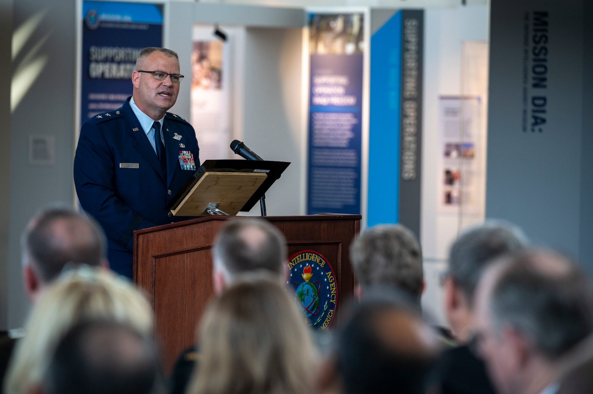 U.S. Air Force Maj. Gen. Daniel A. DeVoe, Air Force District of Washington and 320th Air Expeditionary Wing commander, speaks to an audience during the 77th Intelligence Wing Activation and Assumption of Command Ceremony at Joint Base Anacostia-Bolling, Washington, D.C., July 24, 2025.