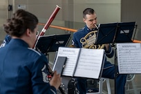 Instrumentalists perform at a change of command ceremony.