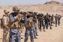 U.S. Marines with 2nd Marine Logistics Group and Jordanian Marines with 77th Marine Battalion, conduct table five of the combat marksmanship program as part of exercise Native Fury in Jordan, July 17, 2025. Native Fury 25 is a biannual exercise focused on the demonstration of the rapid offload and integration of a Maritime Prepositioned Force in the U.S. Central Command area of operations in support of regional security, crisis response, and contingency operations. (U.S. Marine Corps photo by Lance Cpl. Isabella Ramos)