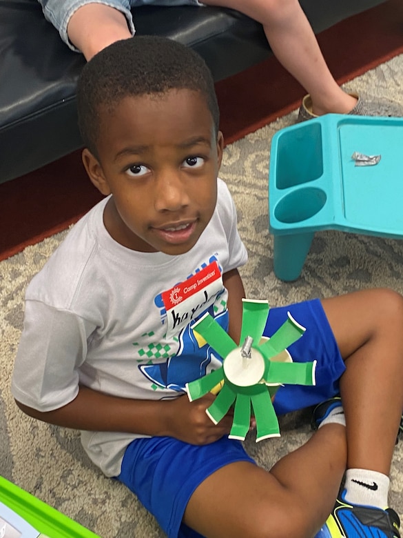 Young elementary students rotate through hands-on STEM activities that encourage creativity and curiosity.