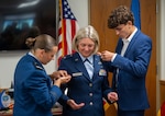 U.S. Air Force Col. Caputo (center) is pinned on the rank of brigadier general by her daughter, U.S. Air Force Academy Cadet , Lilly Caputo, and her son Cal Caputo, during a ceremony at Camp Johnson in Colchester, Vermont, July 25, 2025. Caputo will assume the role of: Chief of Staff - Air, Joint Force Headquarters, Vermont National Guard. (U.S. Air National Guard photo by Senior Master Sgt. Michael Davis)