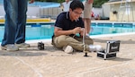 A student with the Naval Surface Warfare Center Indian Head Division’s (NSWC IHD) Naval Energetics Technology Apprenticeship Program (NETAP) maneuvers their underwater remotely operated vehicle for his group’s scenario, July 18 at Naval Support Facility Indian Head.