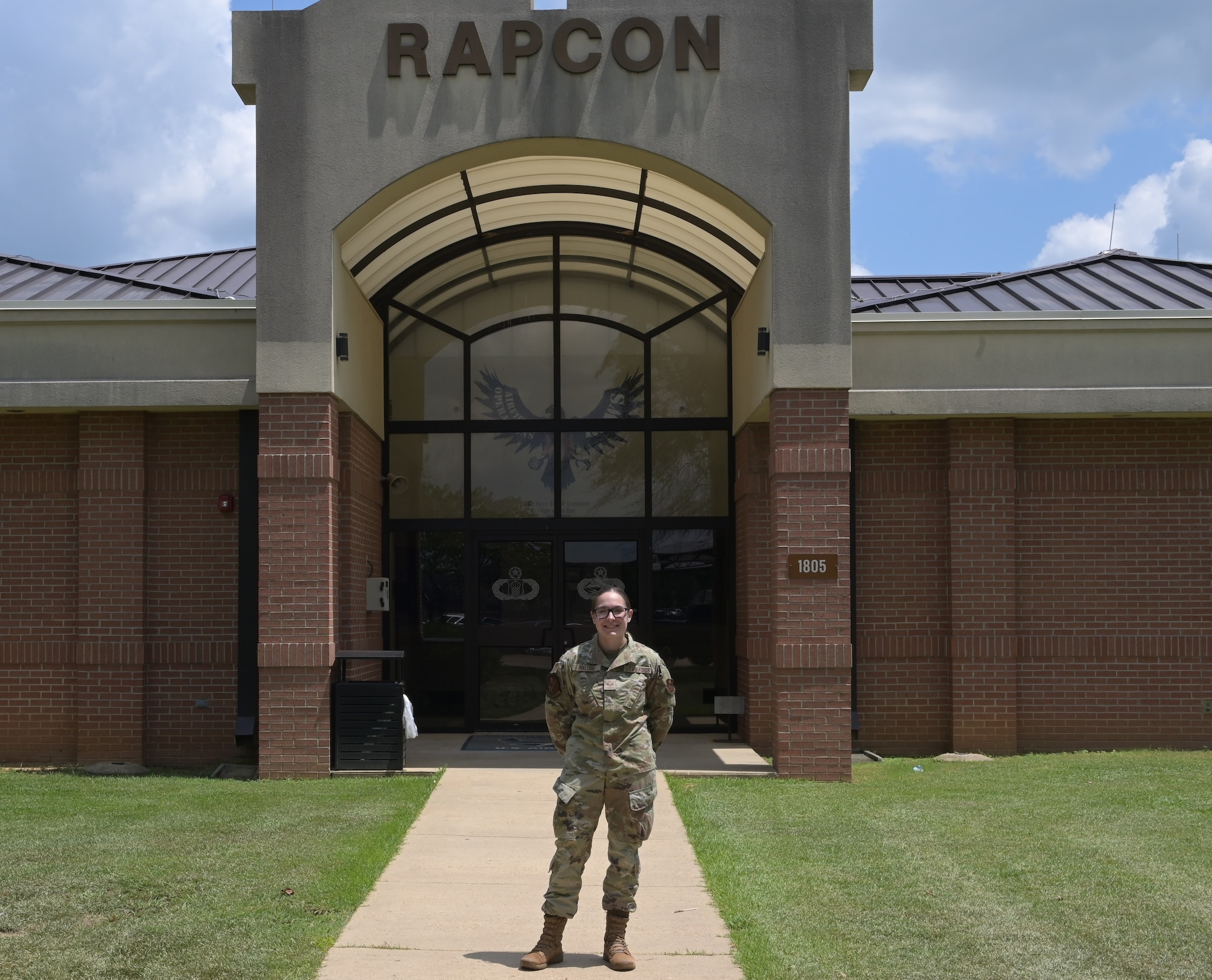 Senior Airman Cheyanne Baldini, Air Traffic Controller, poses for a photo outside the RAPCON building on Columbus Air Force Base, July 30, 2025.