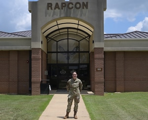 Senior Airman Cheyanne Baldini, Air Traffic Controller, poses for a photo outside the RAPCON building on Columbus Air Force Base, July 30, 2025.