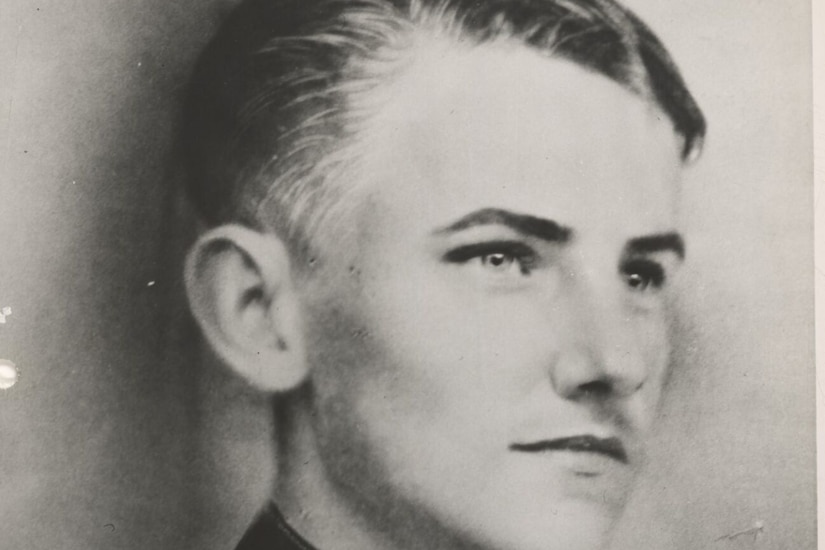 A man in uniform poses for a photo.