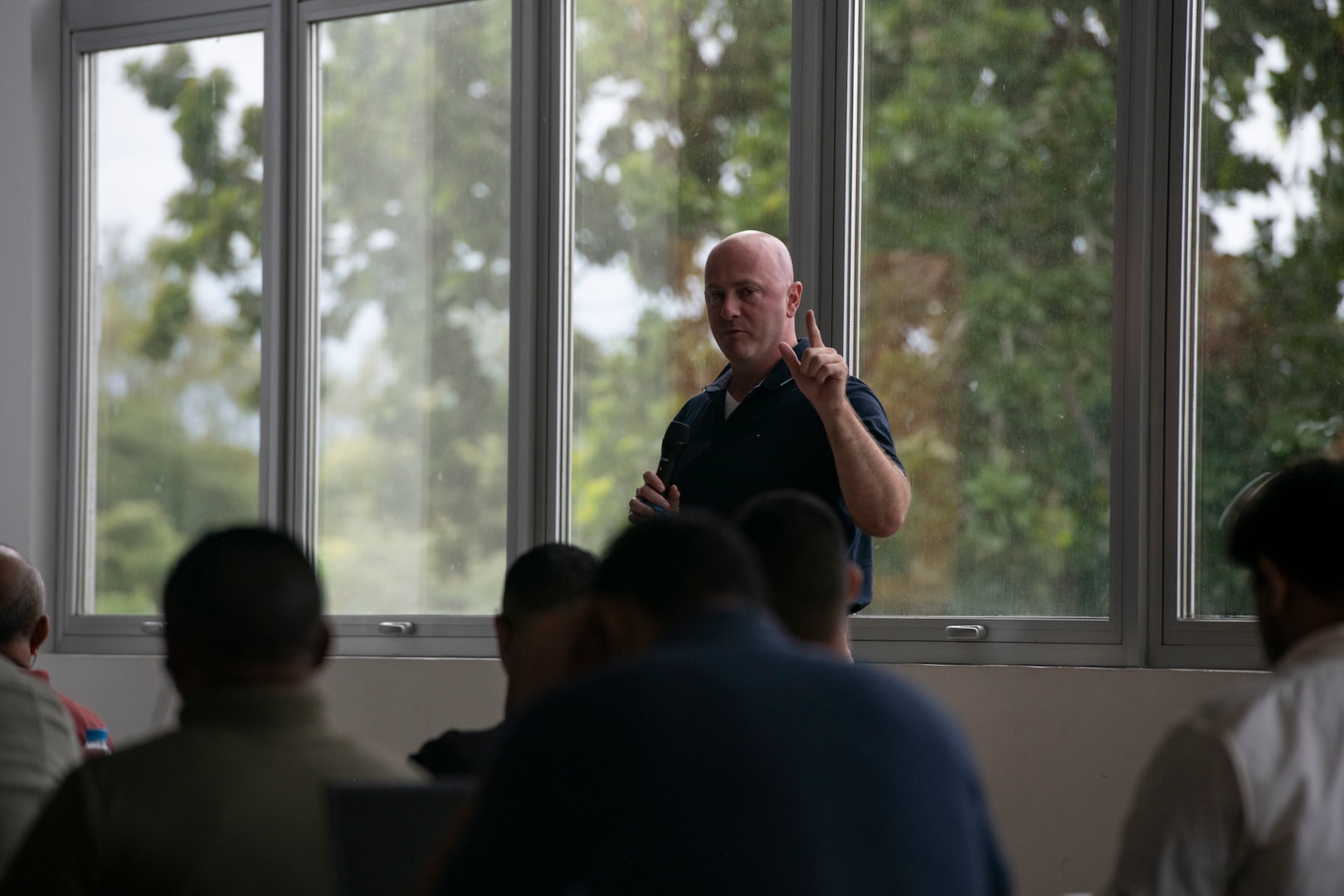 A U.S. Missouri National Guard Soldier answers a question during a cybersecurity subject matter expert exchange with local government members in Panama City, Panama, July 22, 2025. The engagement focused on building shared procedures, improving Panama’s ability to defend critical infrastructure, and preparing both nations for participation in the upcoming multinational exercise PANAMAX. (U.S. Air Force photo by Senior Airman Julia Lebens)