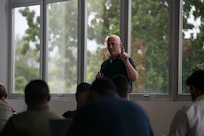 A U.S. Missouri National Guard Soldier answers a question during a cybersecurity subject matter expert exchange with local government members in Panama City, Panama, July 22, 2025. The engagement focused on building shared procedures, improving Panama’s ability to defend critical infrastructure, and preparing both nations for participation in the upcoming multinational exercise PANAMAX. (U.S. Air Force photo by Senior Airman Julia Lebens)