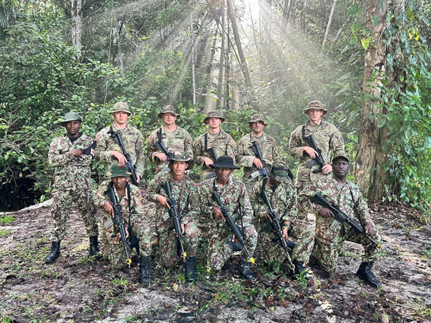 South Dakota National Guard Soldiers with members of the Surinamese Armed Forces during a first-of-its-kind jungle warfare exchange that concluded July 18, 2025.