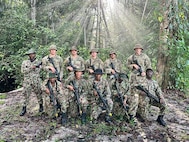 South Dakota National Guard Soldiers with members of the Surinamese Armed Forces during a first-of-its-kind jungle warfare exchange that concluded July 18, 2025.