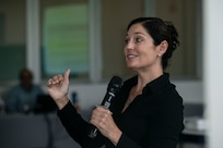 U.S. Missouri National Guard Chief Warrant Officer 3 Katie Herrel, the cyber operations chief for the Missouri National Guard, answers a question during a cybersecurity subject matter expert exchange with local government members in Panama City, Panama, July 22, 2025. The engagement focused on building shared procedures, improving Panama’s ability to defend critical infrastructure, and preparing both nations for participation in the upcoming multinational exercise PANAMAX. (U.S. Air Force photo by Senior Airman Julia Lebens)