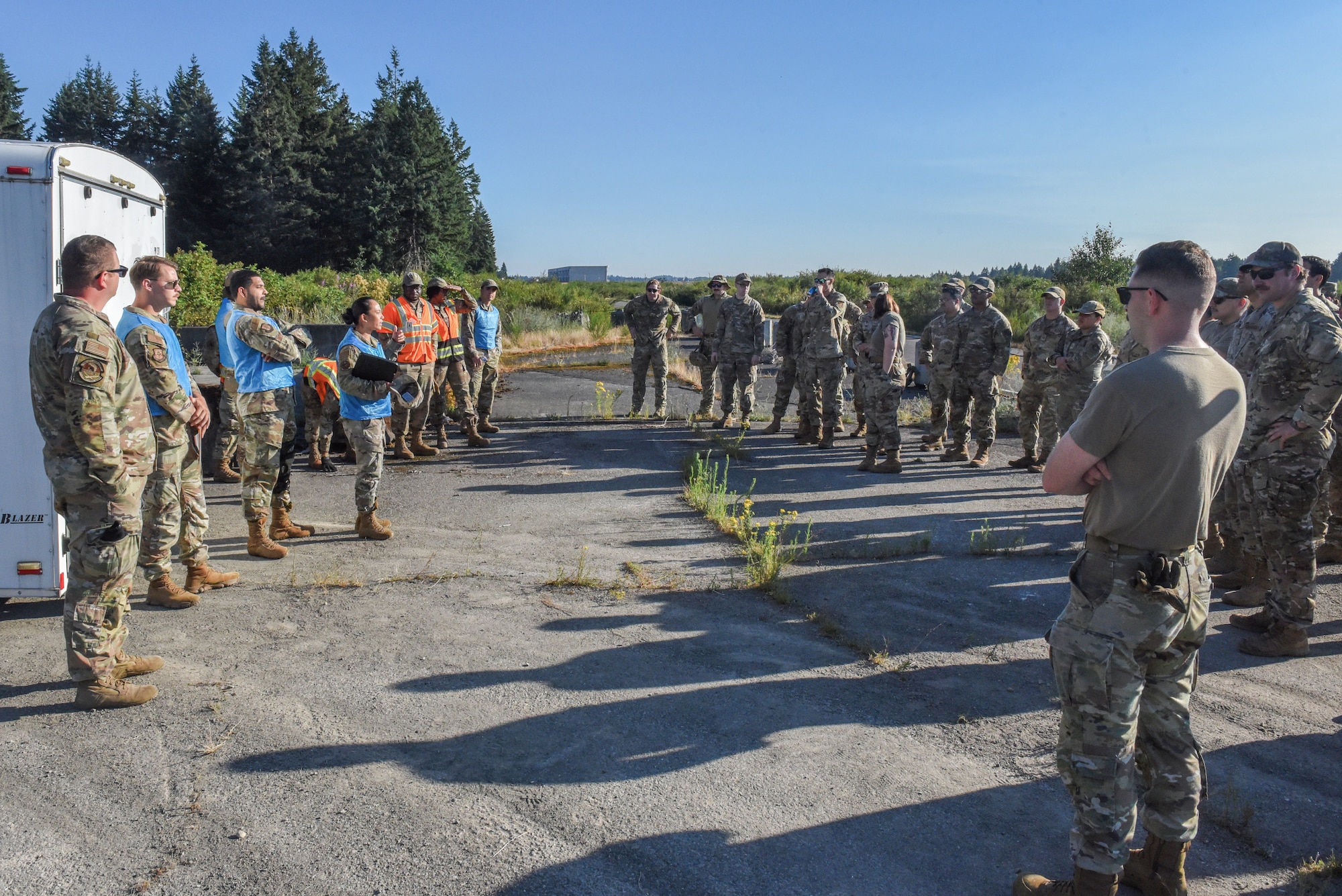 Julius A. Kolb Airman Leadership School class 25-Echo field exercise participants conduct a briefing at Joint Base Lewis-McChord, Washington, July 8, 2025.