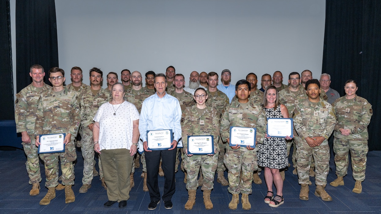 A large group photo of military and civilians