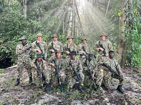 South Dakota National Guard Soldiers with members of the Surinamese Armed Forces during a first-of-its-kind jungle warfare exchange that concluded July 18, 2025.